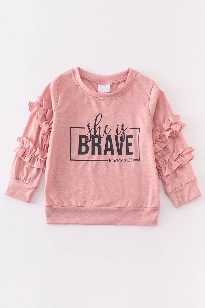 Pink "she is brave" ruffle top